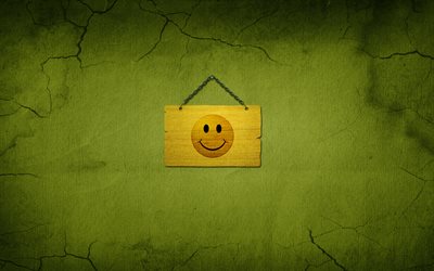 wooden plaque, smiley, green background