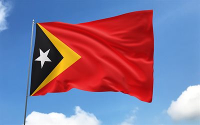 bandeira de timor leste no mastro, 4k, países asiáticos, céu azul, bandeira de timor leste, bandeiras de cetim onduladas, símbolos nacionais de timor leste, mastro com bandeiras, dia de timor leste, ásia, timor leste
