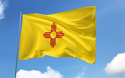 New Mexico flag on flagpole, 4K, american states, blue sky, flag of New Mexico, wavy satin flags, New Mexico flag, US States, flagpole with flags, United States, Day of New Mexico, USA, New Mexico