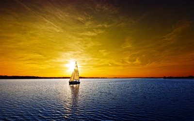 horizon, un voilier, un coucher de soleil, le lac