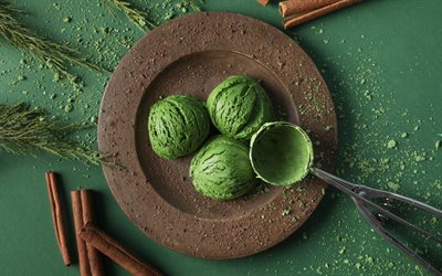 Green ice cream, top view, Christmas ice cream, green ice cream scoops, cinnamon sticks, green background, sweets