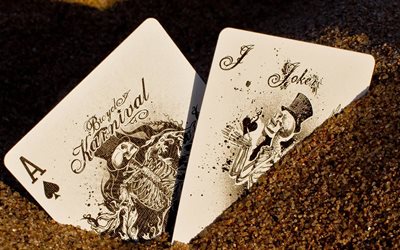playing cards, sand, joker