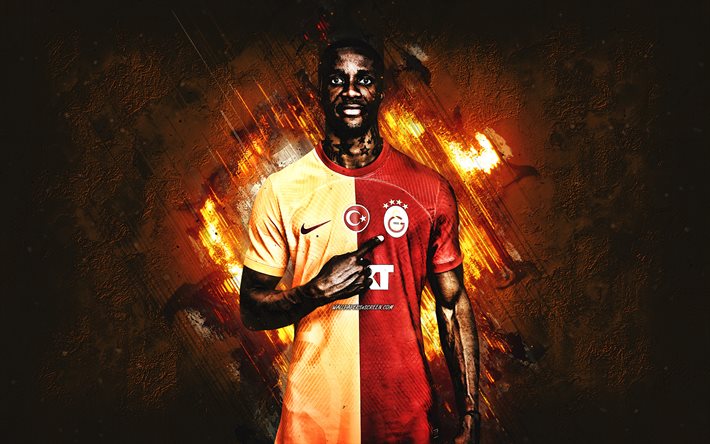 ウィルフリードザハ, ガラタサライ, アイボリアのサッカー選手, オレンジ色の石の背景, 七面鳥, フットボール