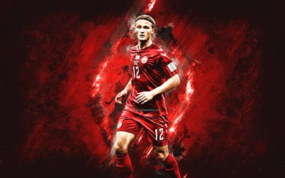 kasper dolberg, dänische fußballnationalmannschaft, dänischer fußballspieler, nach vorne, porträt, roter steinhintergrund, katar 2022, dänemark, fußball