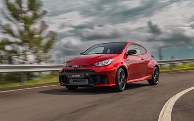 Toyota GR Yaris, 4k, motion blur, 2026 cars, clouds, 2026 Toyota GR Yaris, Red Toyota GR Yaris, japanese cars, Toyota