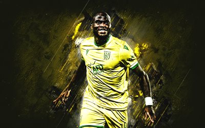 ignatius ganago, fc nantes, kamerunin jalkapalloilija, eteenpäin, muotokuva, keltainen kivi tausta, ligue 1, ranska, jalkapallo