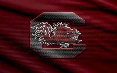 logo en tissu des gamecocks de caroline du sud, 4k, fond de tissu marron, ncaaf, bokeh, football américain, logo des gamecocks de caroline du sud, ncaa, emblème des gamecocks de caroline du sud, seconde, gamecocks de caroline du sud