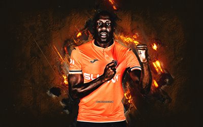 Stefano Okaka, Istanbul Basaksehir, portrait, Italian football player, orange stone background, Turkey, football, Basaksehir