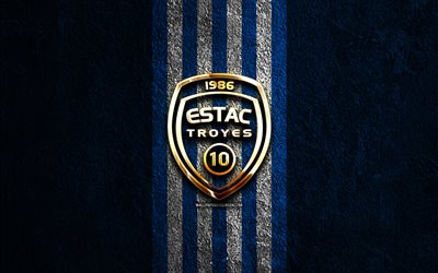 ES Troyes AC golden logo, 4k, blue stone background, Ligue 1, french football club, ES Troyes AC logo, soccer, ES Troyes AC emblem, ES Troyes AC, football, Troyes FC