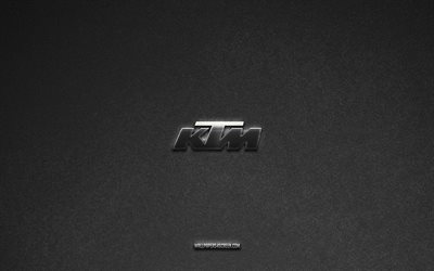 KTM logo, gray stone background, KTM emblem, car logos, KTM, car brands, KTM metal logo, stone texture