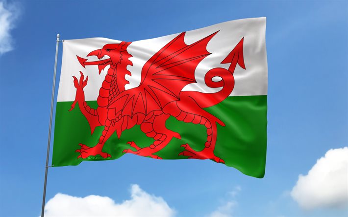 wales flagge am fahnenmast, 4k, europäische länder, blauer himmel, flagge von wales, gewellte satinfahnen, walisische flagge, walisische nationalsymbole, fahnenmast mit fahnen, tag von wales, europa, wales flagge, wales