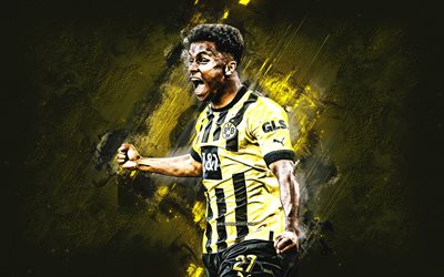 Karim Adeyemi, Borussia Dortmund, German football player, portrait, yellow stone background, Bundesliga, Germany, football