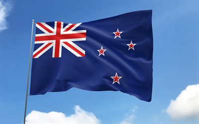 neuseeländische flagge am fahnenmast, 4k, ozeanische länder, blauer himmel, flagge von neuseeland, gewellte satinfahnen, neuseeland flagge, neuseeländische nationalsymbole, fahnenmast mit fahnen, tag von neuseeland, ozeanien, neuseeland