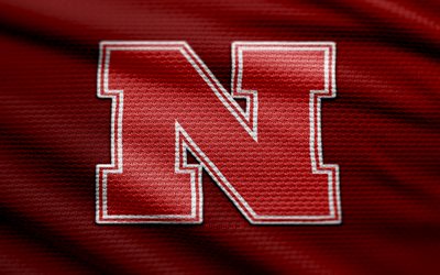 Nebraska Cornhuskers fabric logo, 4k, red fabric background, NCAAF, bokeh, american football, Nebraska Cornhuskers logo, NCAA, Nebraska Cornhuskers emblem, Big Ten, Nebraska Cornhuskers