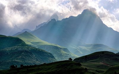 mountains, clouds, the rays of the sun, green hills