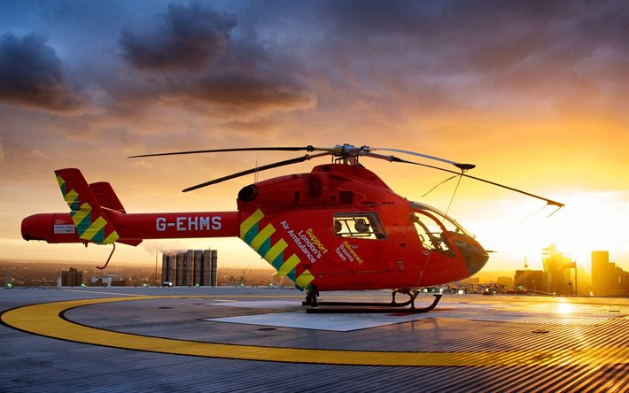 um helicóptero de resgate, helicóptero médico, pôr do sol