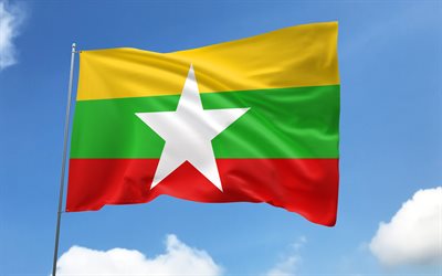 myanmar flagga på flaggstången, 4k, asiatiska länder, blå himmel, myanmars flagga, vågiga satinflaggor, myanmar flagga, myanmars nationella symboler, flaggstång med flaggor, myanmars dag, asien, myanmar